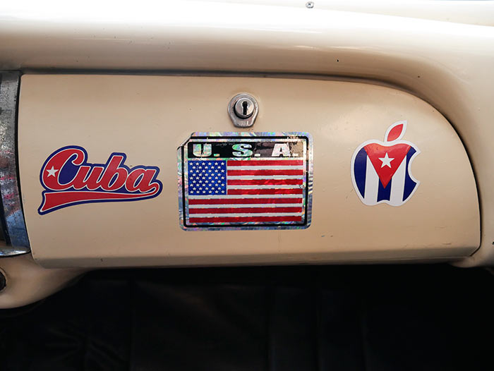banners about cuba and usa in a car in my photography guided tours to cuba